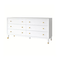 White dresser; six closed drawers, gold knobs, mid-century style.