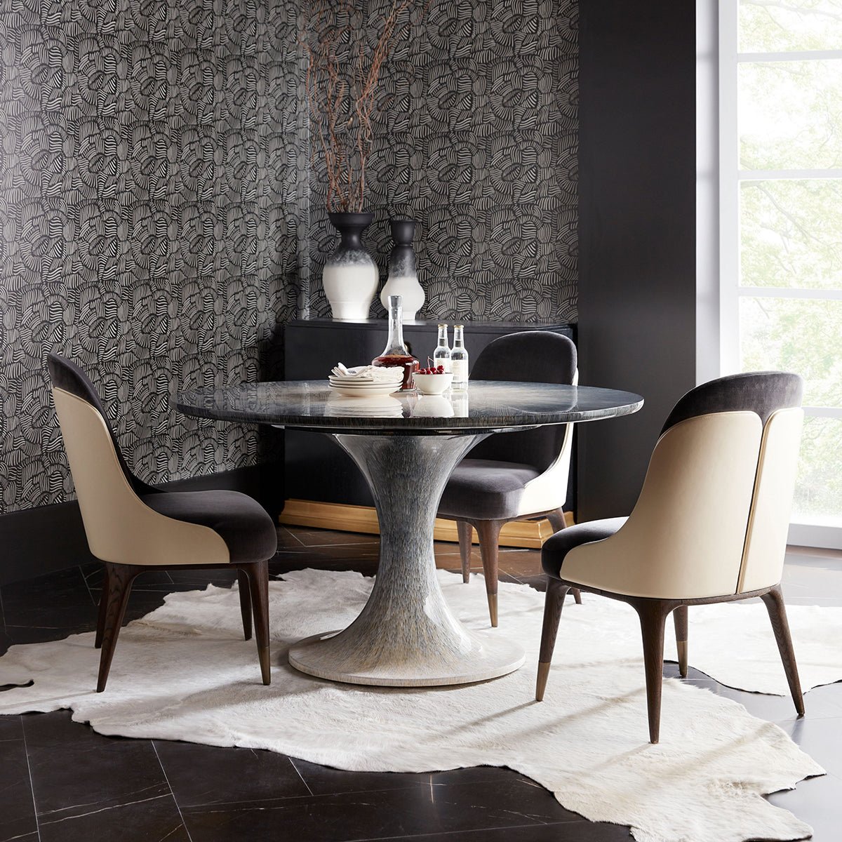 Mid-century upholstered dining chairs around dining table ensemble.