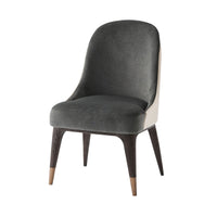 Mid-century upholstered dining chair, angled front view.