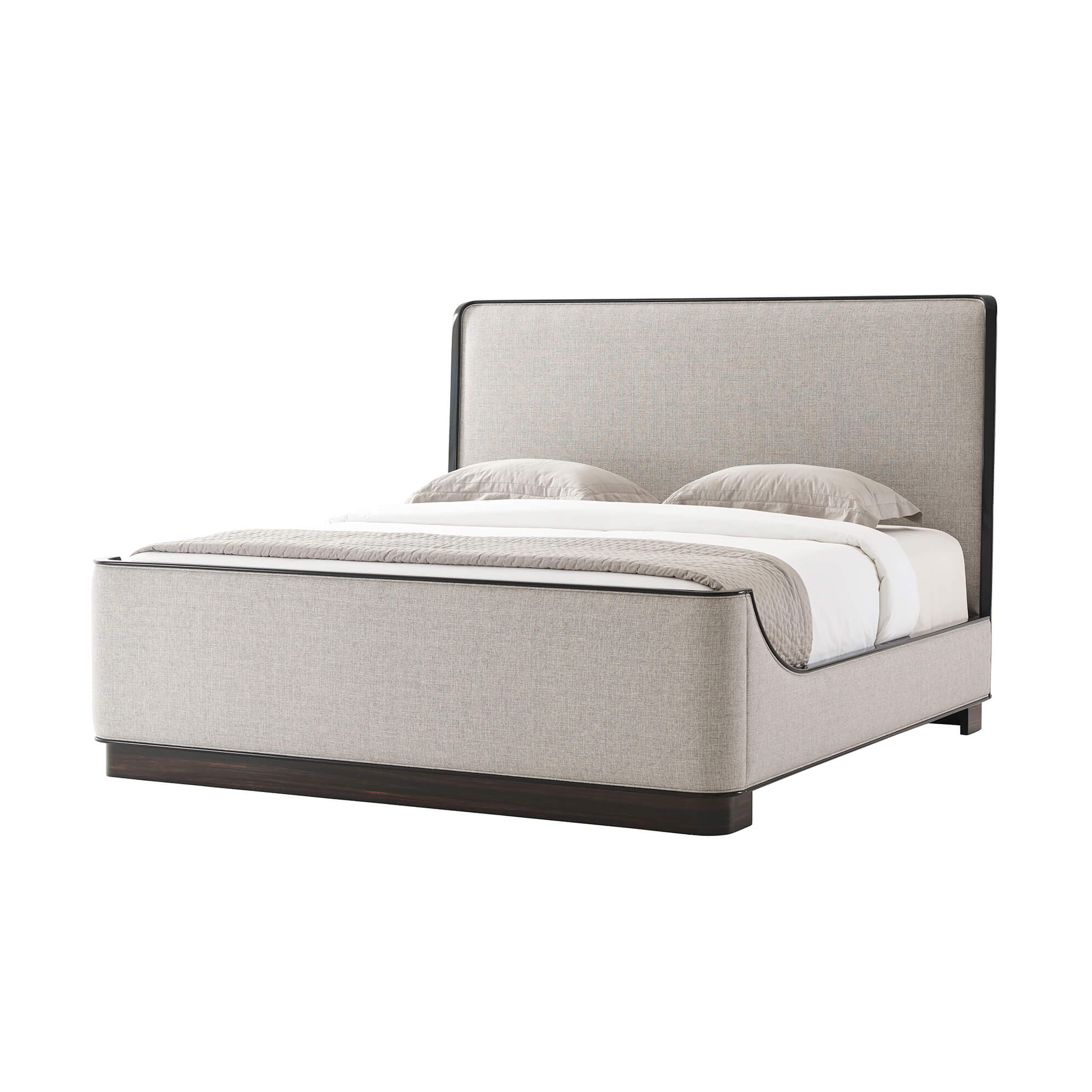 Beige upholstered king size bed with pillows on top.