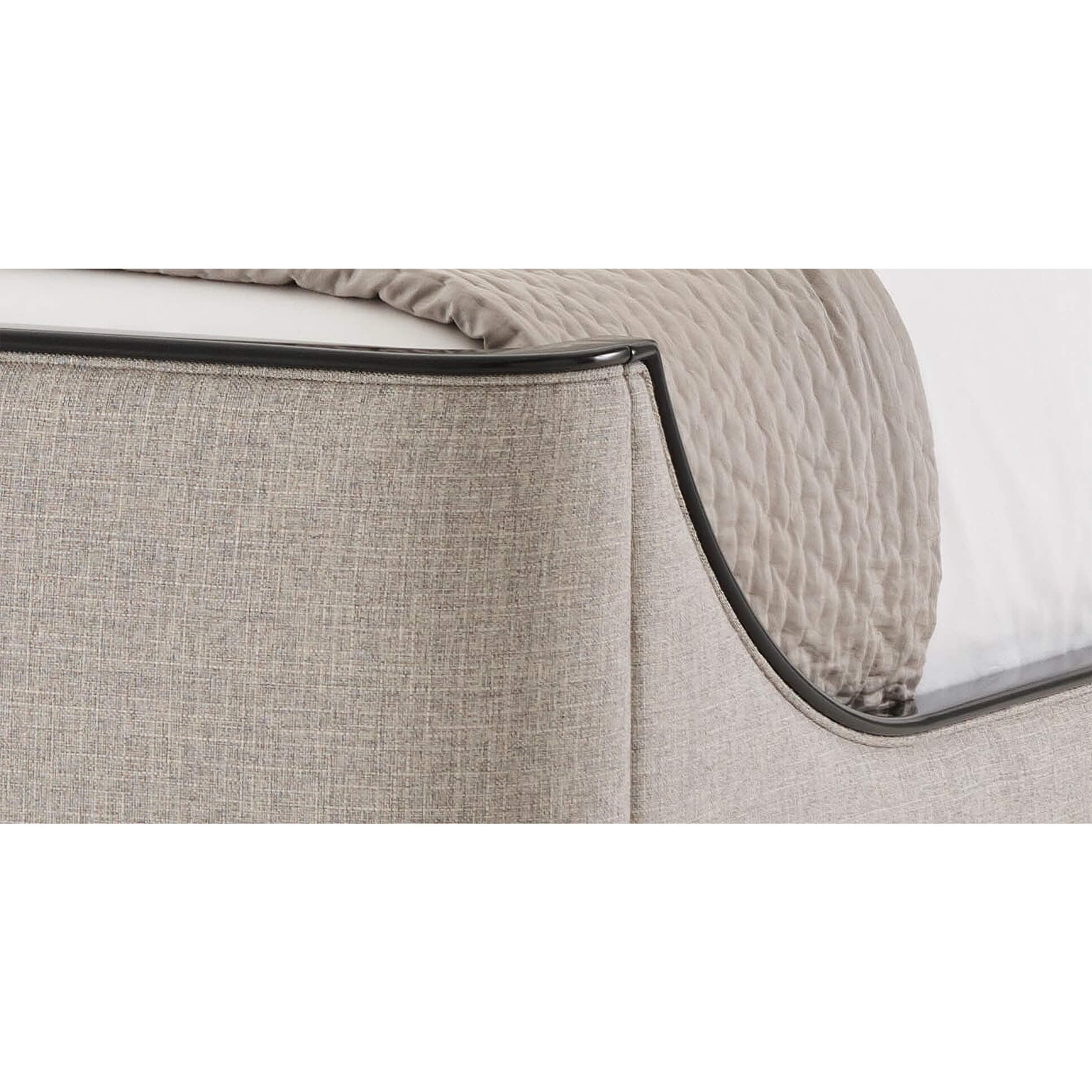 Close-up of bed corner detail with black trim.