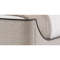 Close-up of bed corner detail with black trim.