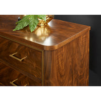 Close-up of walnut bedside chest corner and decor.