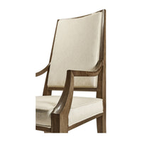 Close-up of armrest and backrest on walnut armchair.