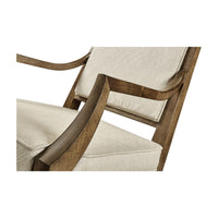 Detailed armrest and cushion on mid-century walnut armchair.