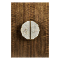 Close-up of decorative handle on sideboard.