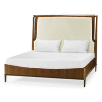 Mid-century walnut upholstered bed, angled view.