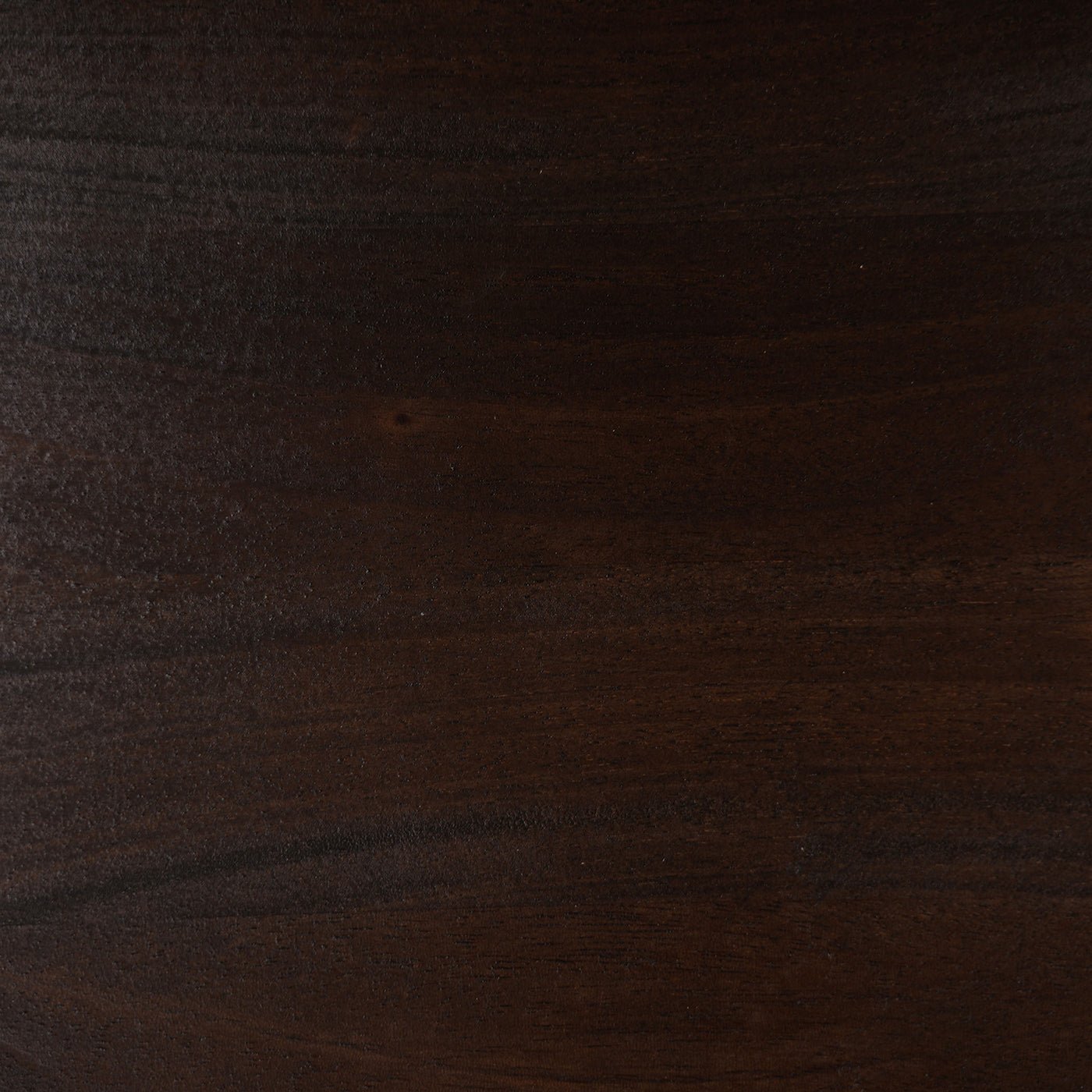 Close-up walnut finish texture, mid-century furniture style.