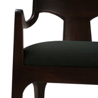 Close-up chair arm and cushion, dark green, walnut.