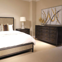 Dark wood bedroom furniture set with modern bed, lamp.