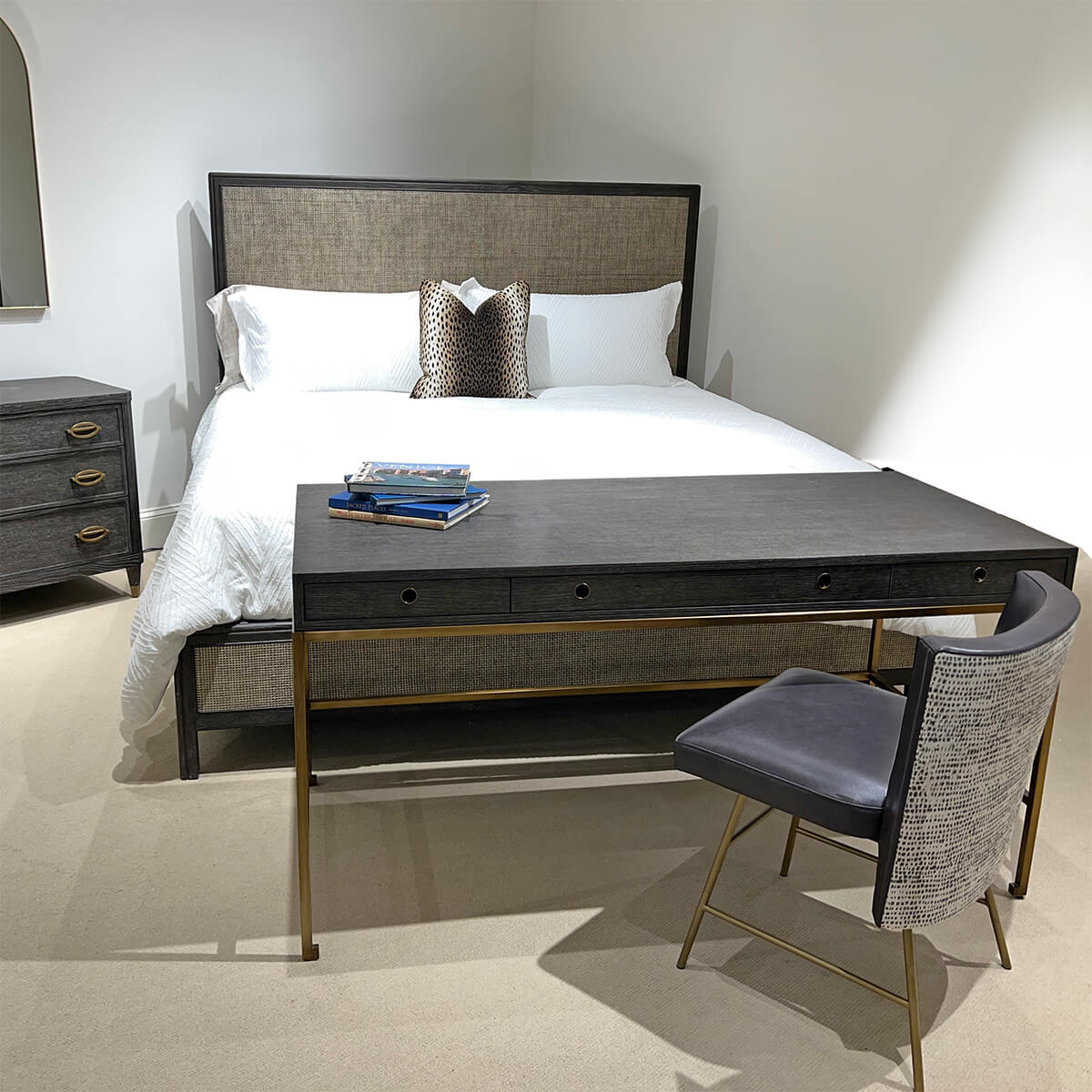 Desk in bedroom setting, paired with chair and bed.