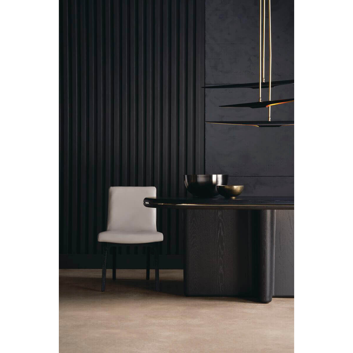 Single chair beside dining table, modern black interior.