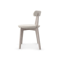 Minimal oak dining chair, side profile view.