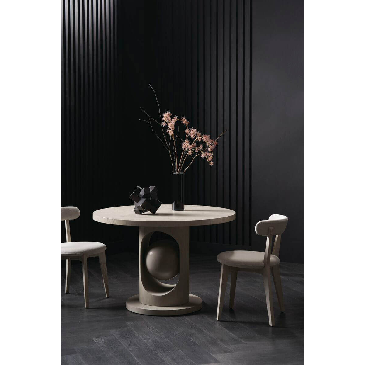Minimal oak dining chairs around a round table.