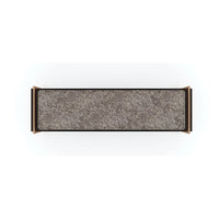 Minimalist bench with textured fabric, top view.