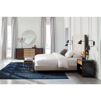Minimalist bench in luxurious bedroom setting, wide shot.