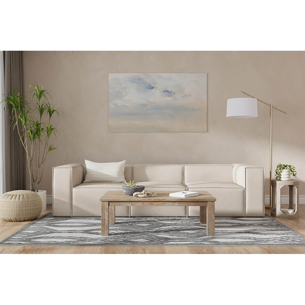 Minimalist linen sofa in styled living room setting.