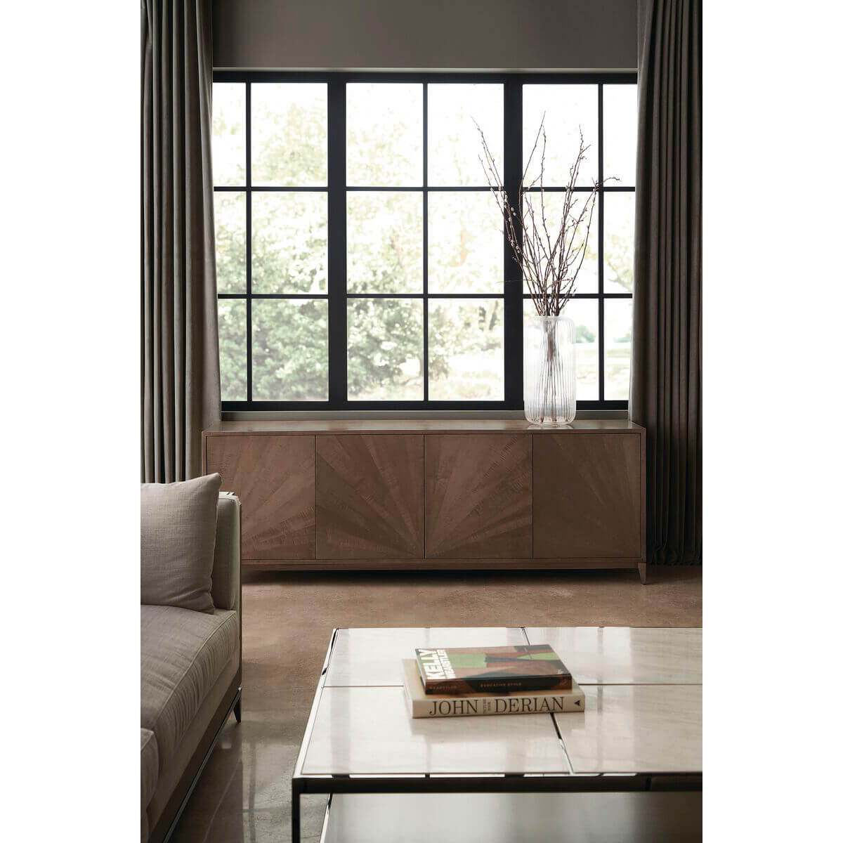 Minimalist coffee table in modern living room, window background.