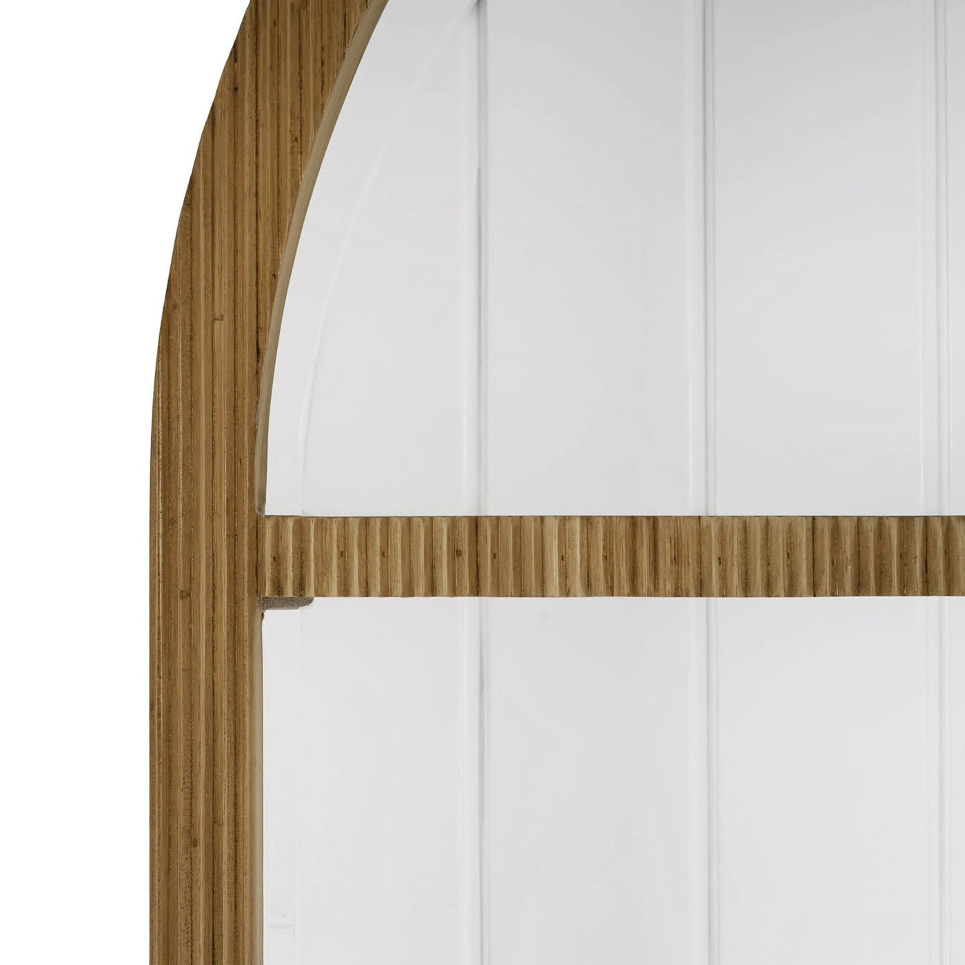 Close-up of bookshelf arch; detailed wood texture.