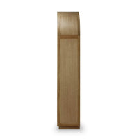 Side view of modern arched bookshelf; wood finish.