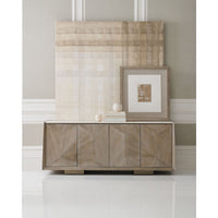 Styled modern ash buffet with decorative items and art.