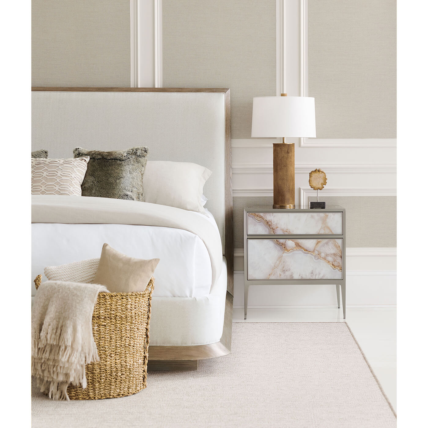 Bed with nightstand and basket, cozy setup.