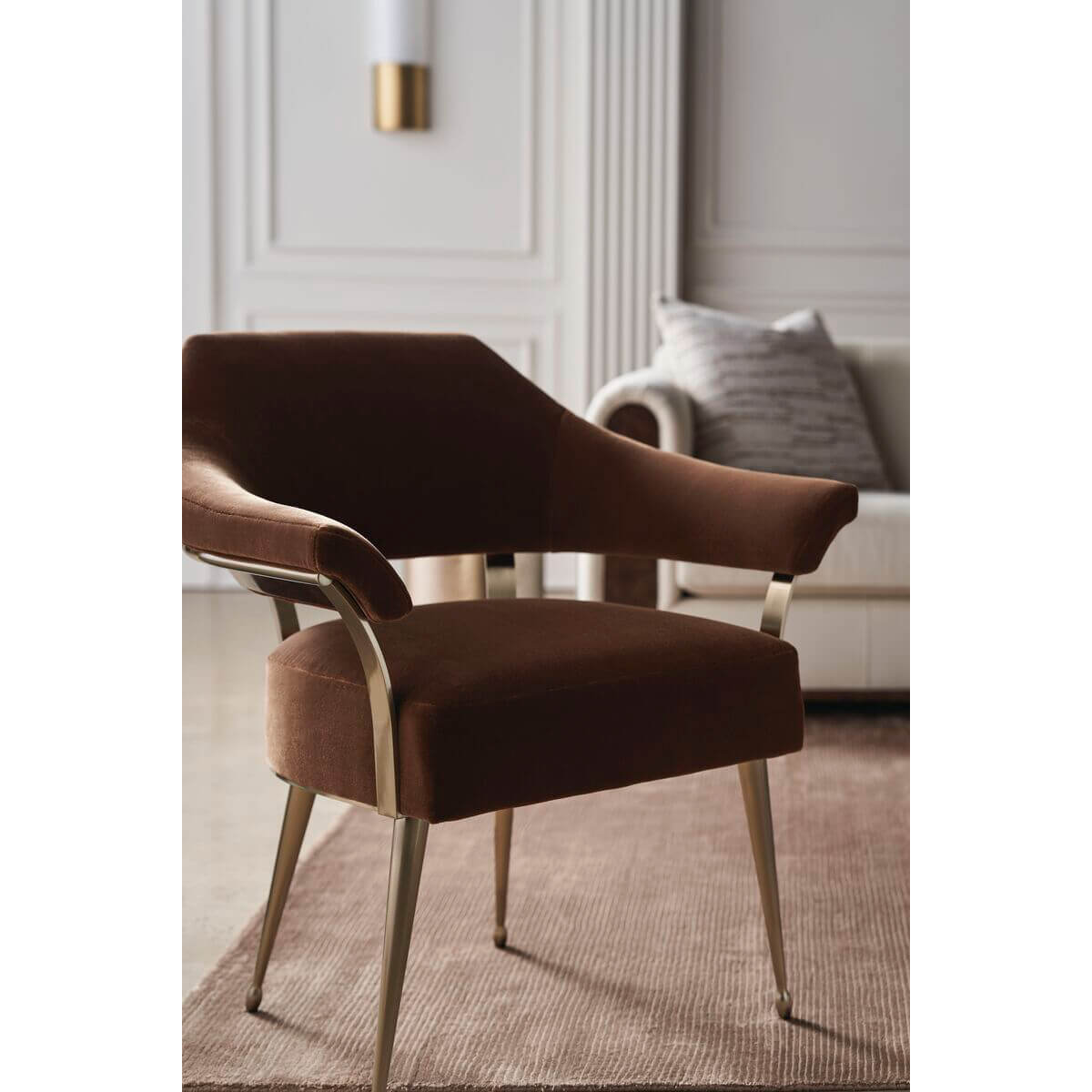 Modern barrel back armchair, angled close-up, rich upholstery.