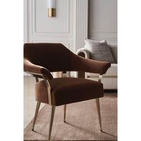 Modern barrel back armchair, angled close-up, rich upholstery.