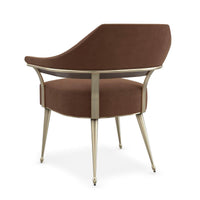 Modern barrel back armchair, back view, sleek design.