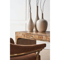 Modern barrel back armchair, desk vignette, artistic display.