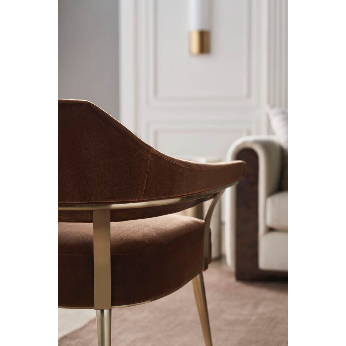 Modern barrel back armchair, rear detail, contemporary interior.