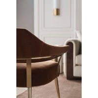 Modern barrel back armchair, rear detail, contemporary interior.