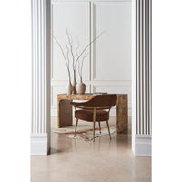 Modern barrel back armchair, at desk, minimalist decor.