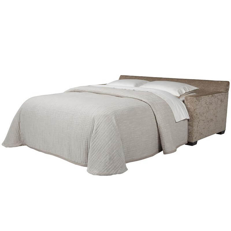 Bella sleeper sofa fully extended into bed with bedding.