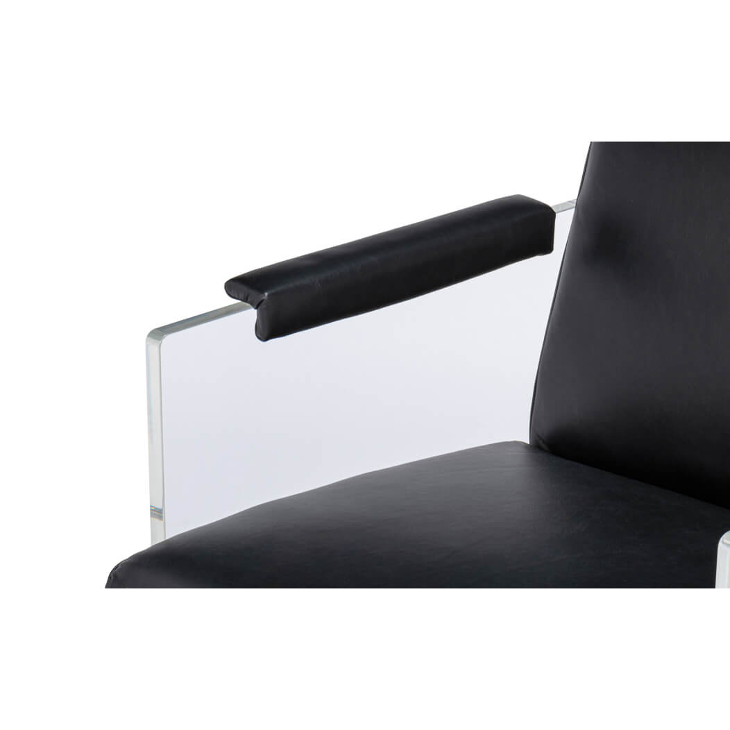 Close-up of armrest on black leather lucite chair