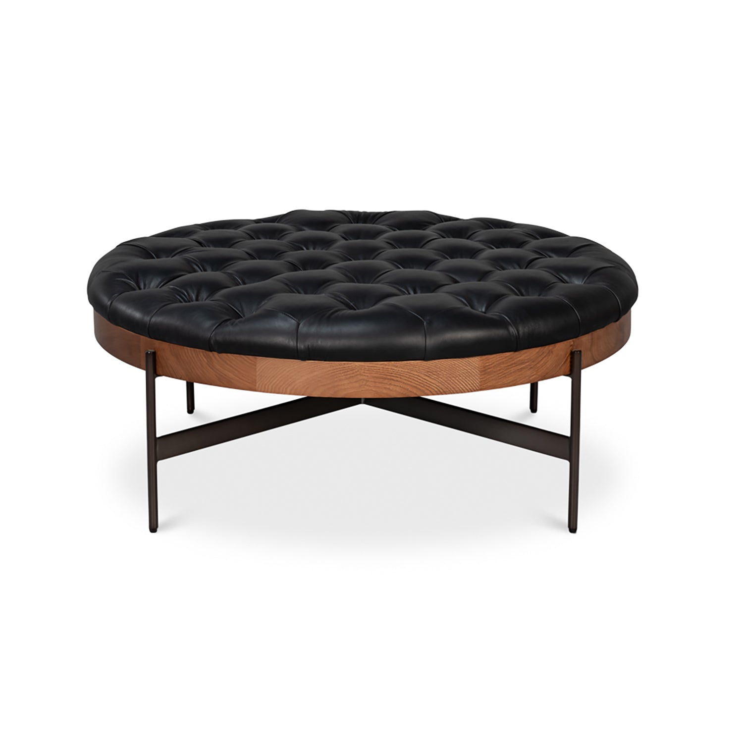 Front angle of round black leather cocktail ottoman.