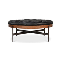 Black leather ottoman showcasing side and leg design.