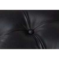 Tufted leather close-up displaying luxury texture.