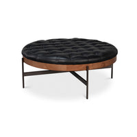 Round ottoman side view showing leather and wood details.