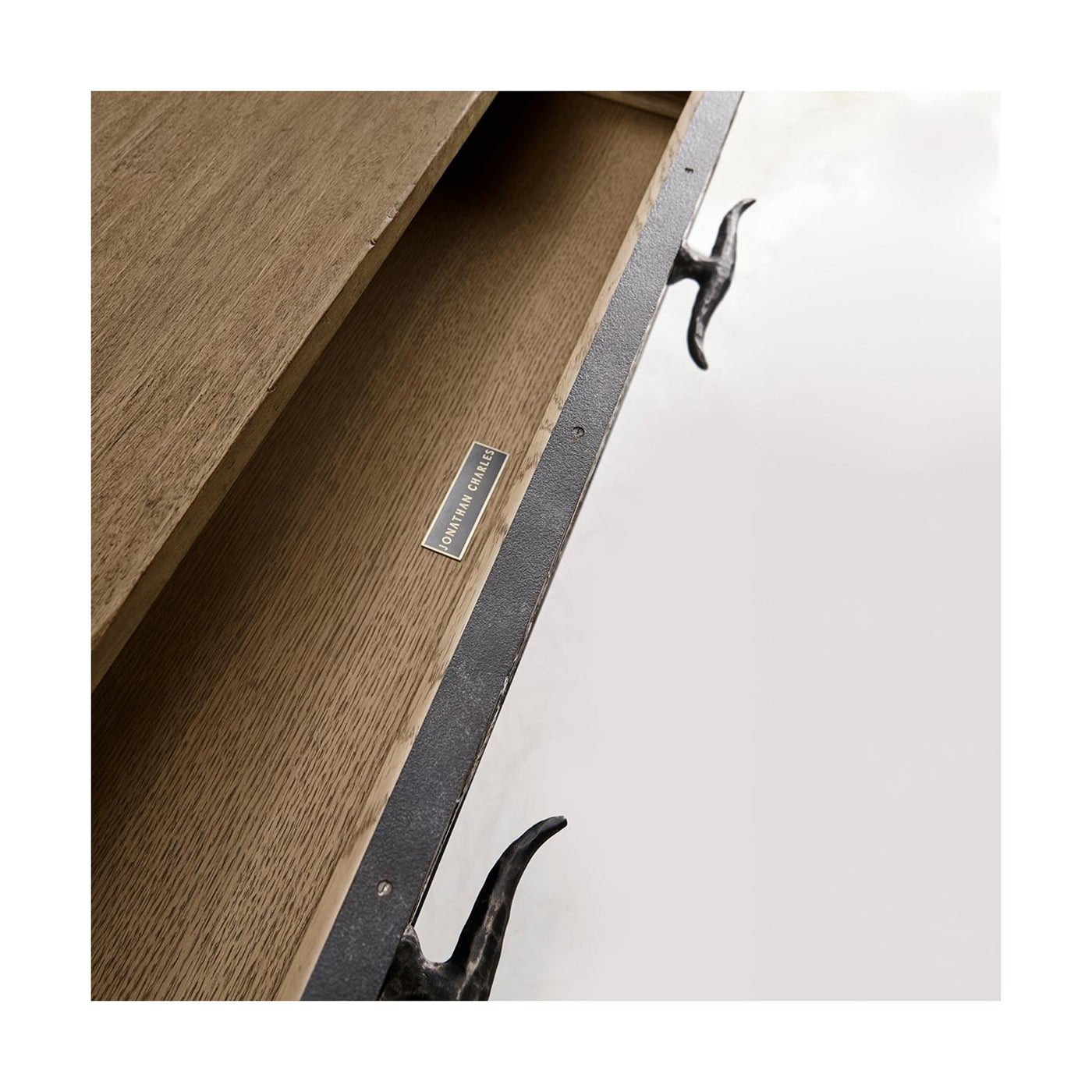 Close-up of sideboard interior with logo.