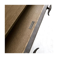 Close-up of sideboard drawer with logo plate.