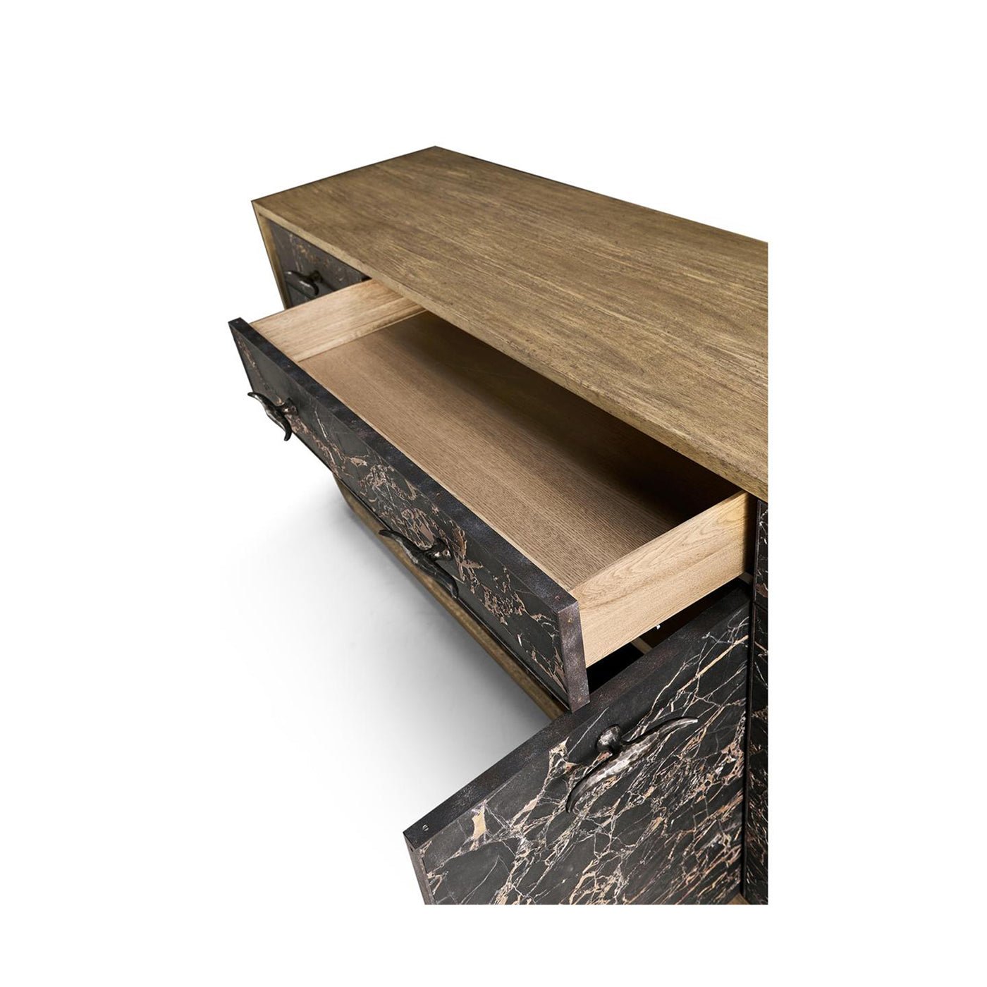 Open sideboard drawer on wooden surface.