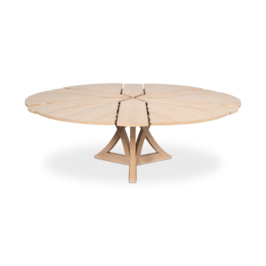 Partially extended oak dining table with visible leaf gaps.