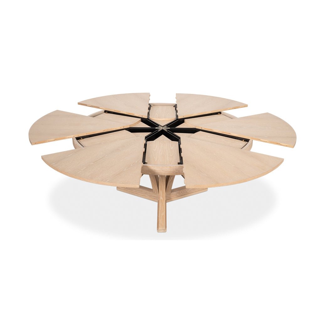 Jupe table extension leaves opening from central mechanism.