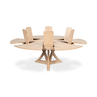 Jupe dining table with extension leaves in raised position.