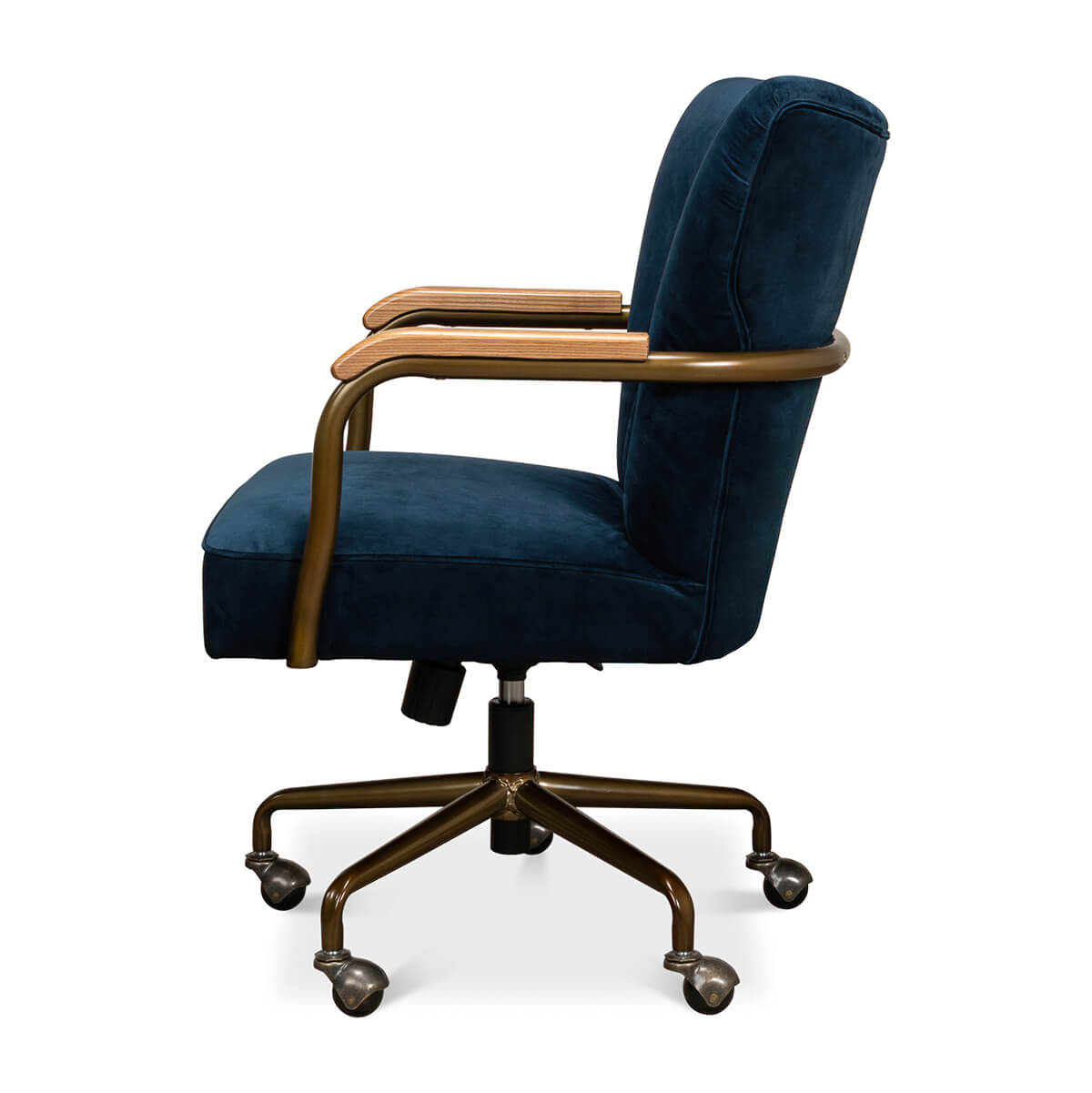 Blue velvet desk chair, side profile with wooden armrest.