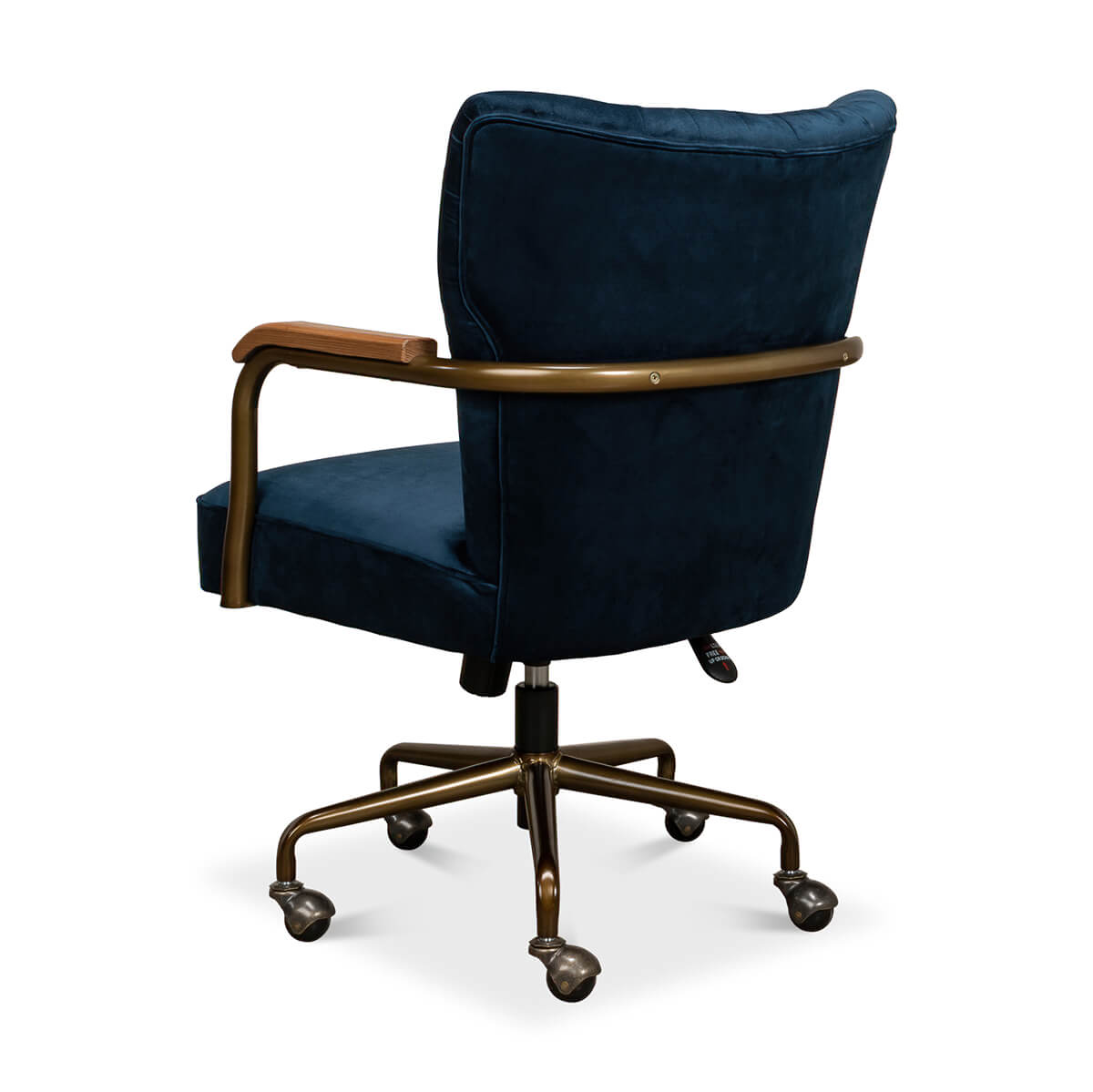 Blue velvet desk chair, angled rear showing wheels and base.