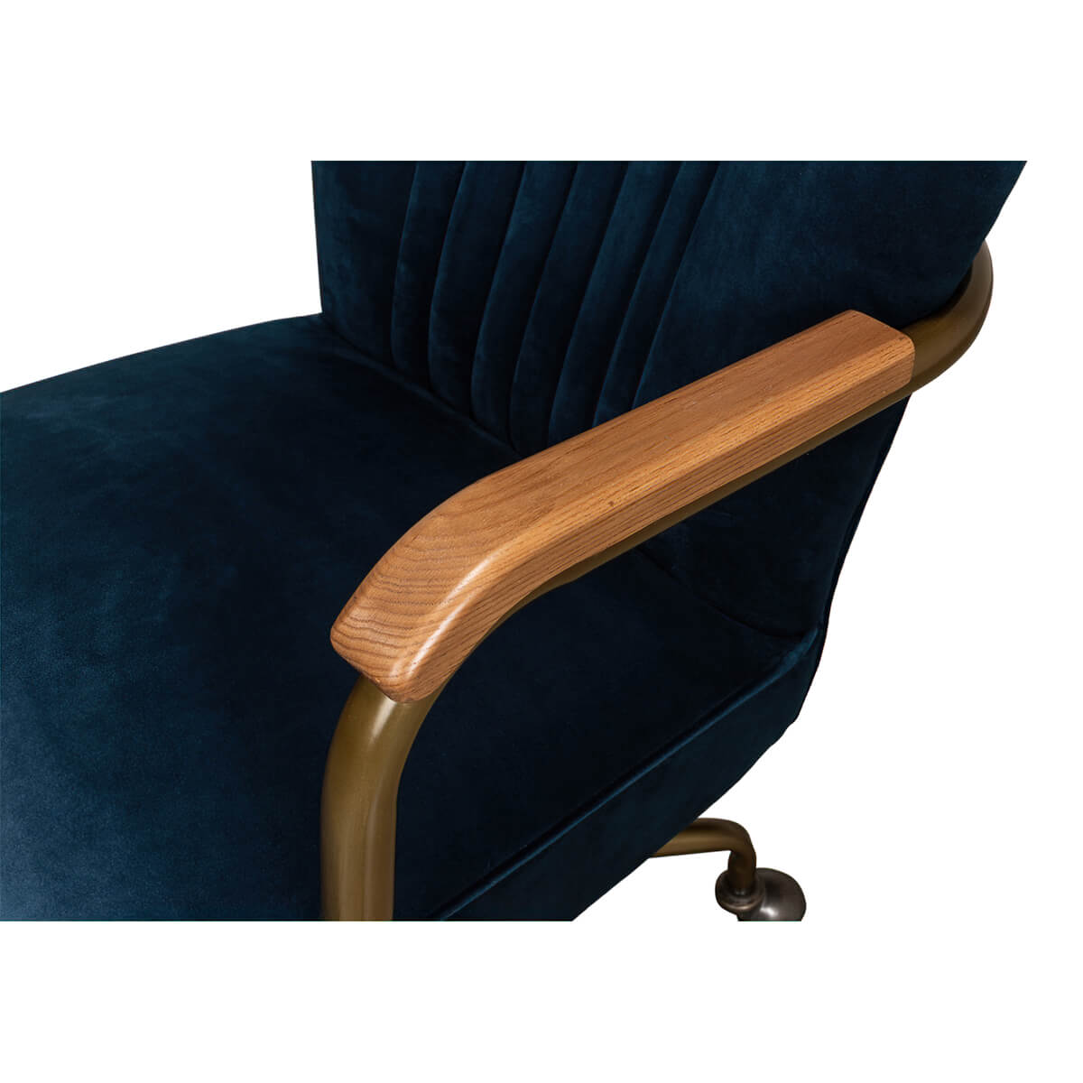 Wooden armrest detail on blue velvet desk chair.