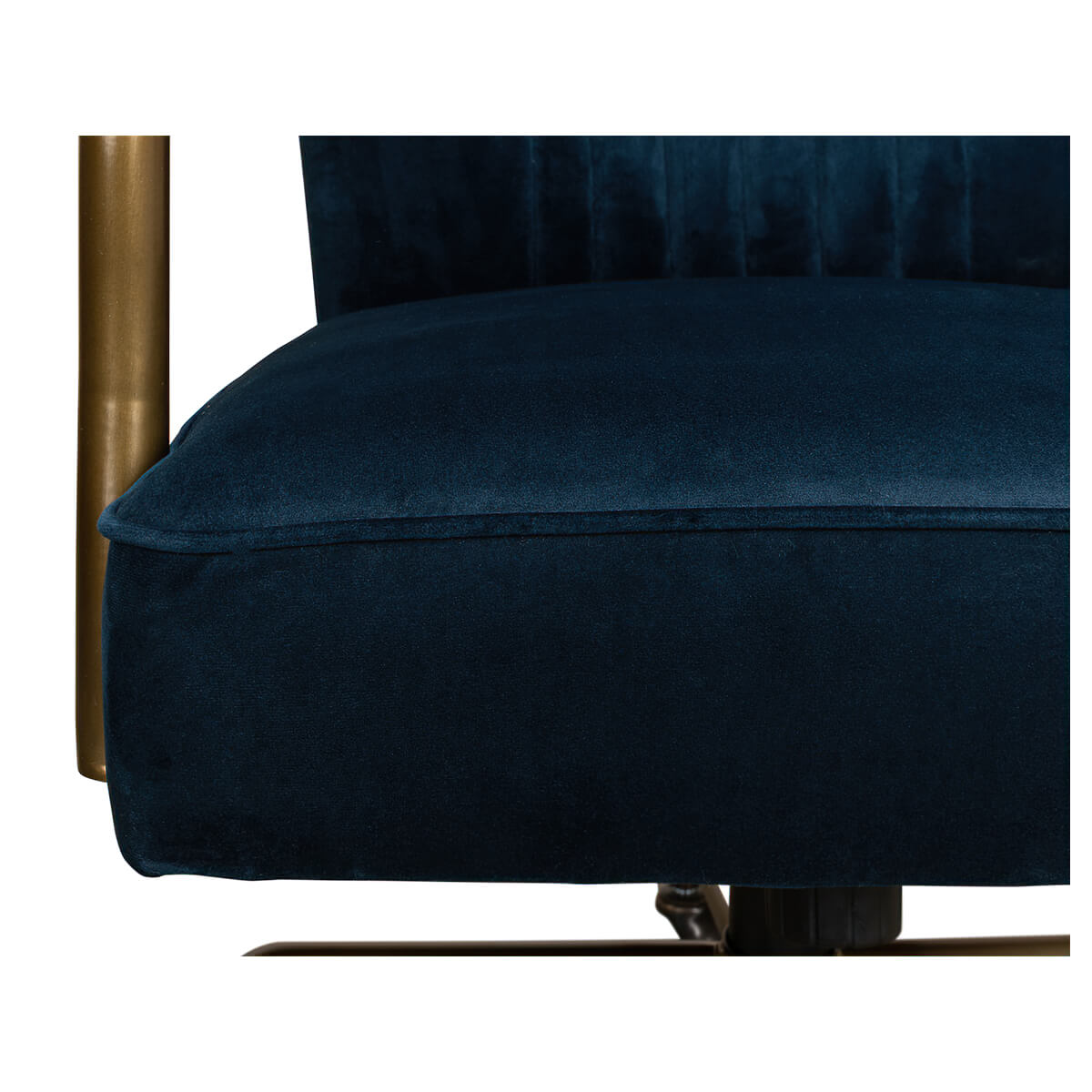 Close-up of seat cushion on blue velvet desk chair.
