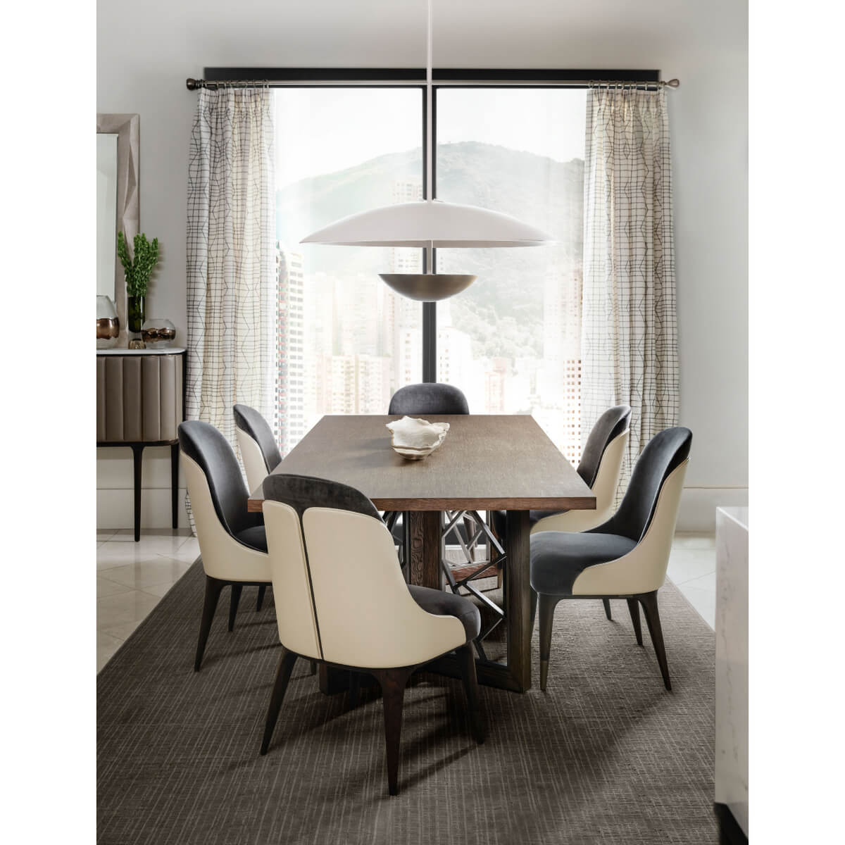 Modern Bowl Chandelier, illuminating modern dining room setting.